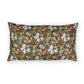 A rectangular decorative throw pillow featuring a dense, vintage-style floral and botanical pattern in olive green, cream, coral pink, and gold tones, set against a plain white background.