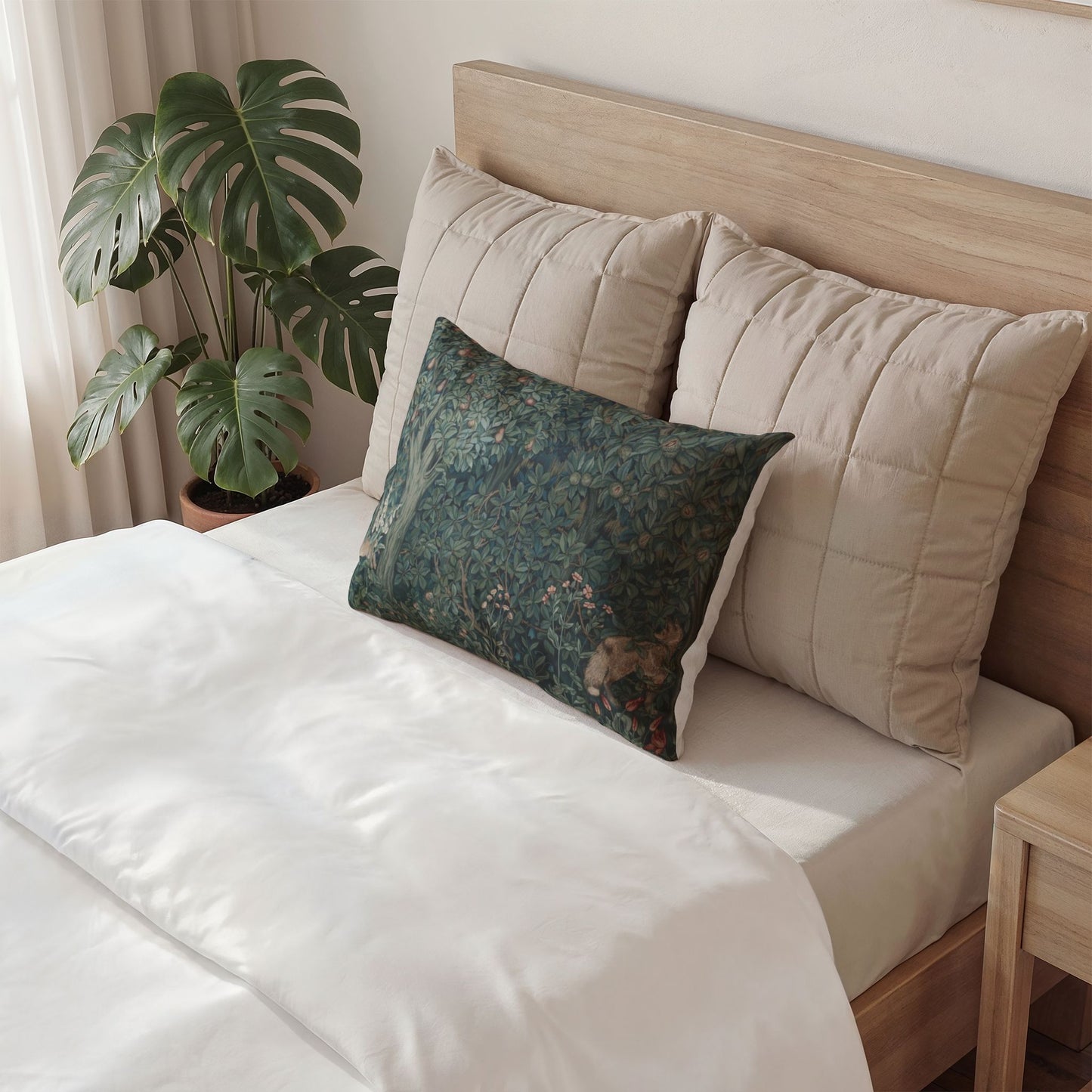 Gray pillow with text on a bed in a bedroom setting