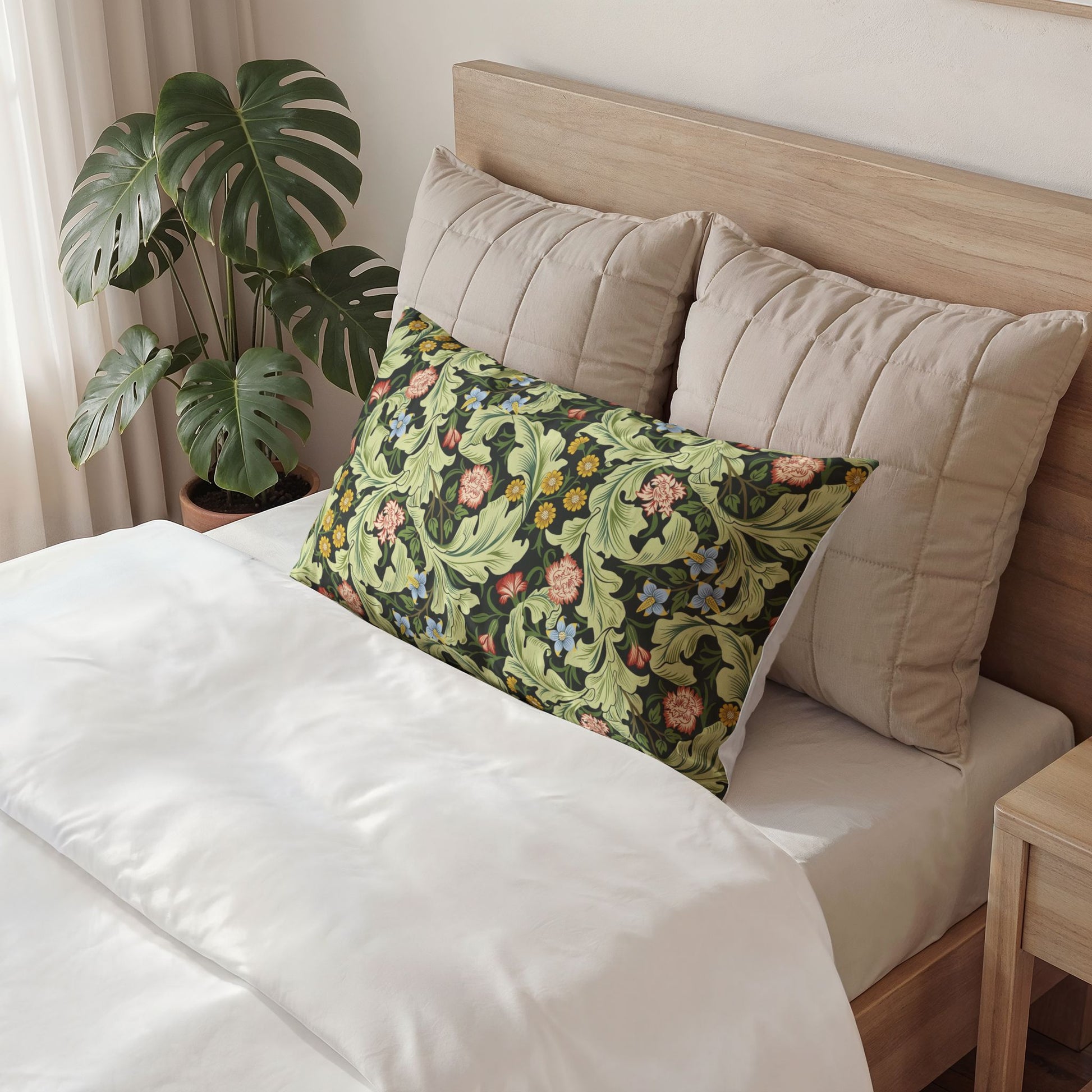 Decorative pillow with floral pattern on a bed in a bedroom setting