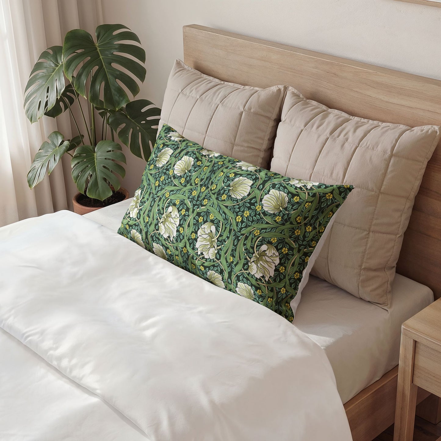 Decorative pillow with floral pattern on a bed in a bedroom setting