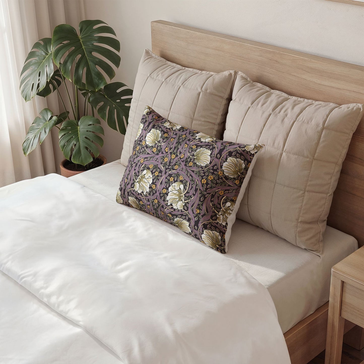 Decorative pillow with a face on it on a bed in a bedroom setting.