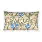 A rectangular decorative throw pillow featuring an Arts and Crafts style floral pattern with blue irises, green leaves, and small birds on a beige background.