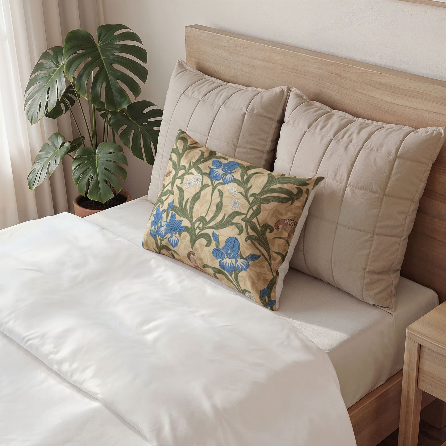 Decorative pillow on a bed with a floral pattern in a bedroom setting