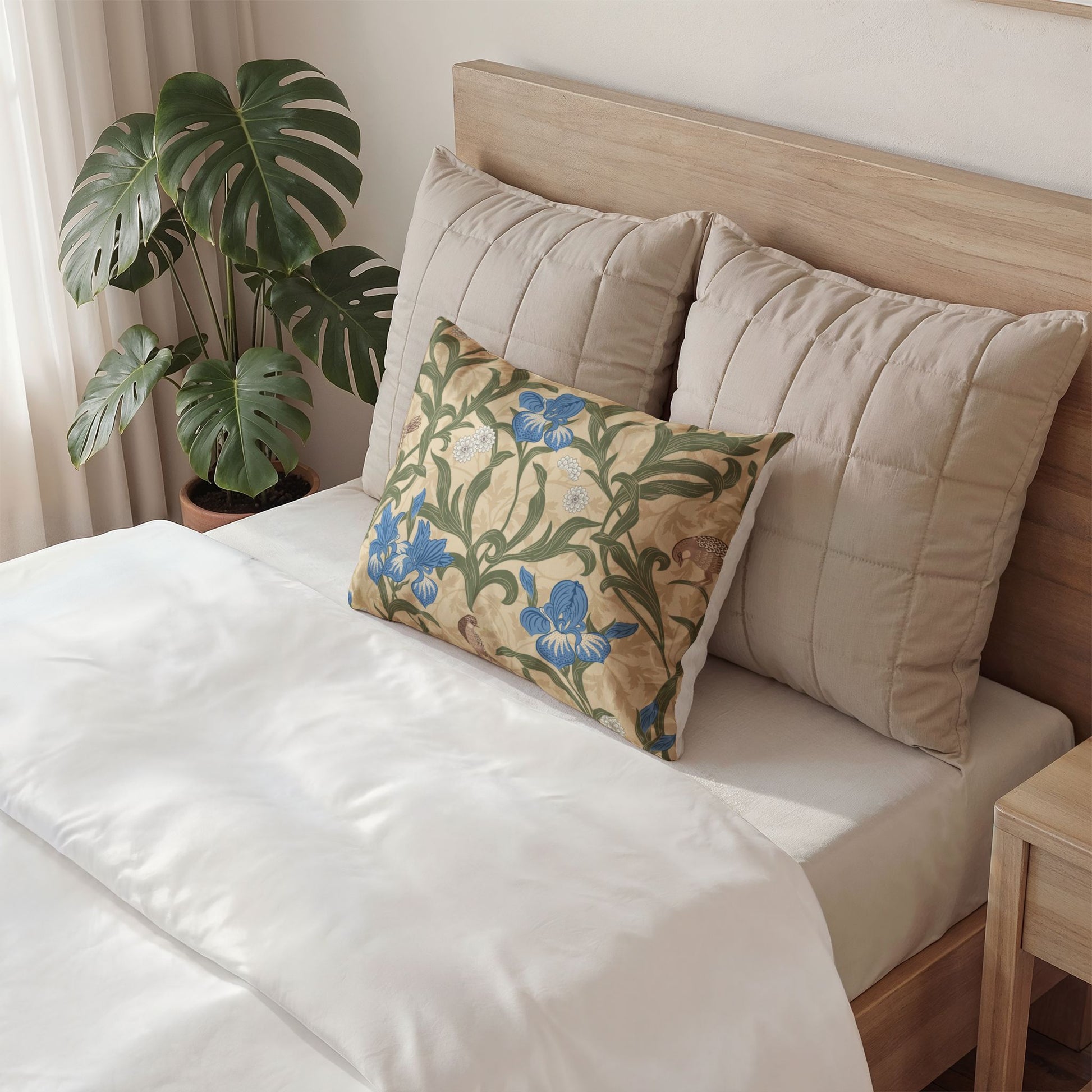 Decorative pillow on a bed with a floral pattern in a bedroom setting