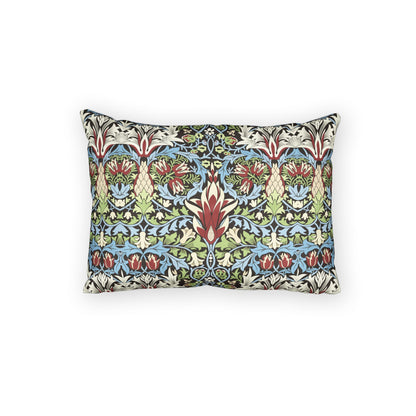 A rectangular decorative throw pillow featuring a dense, symmetrical botanical pattern in green, blue, red, and beige, set against a plain white background.