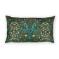 A rectangular lumbar throw pillow featuring a dense, symmetrical botanical pattern in dark green, teal, blue, white, and orange on a solid white background.