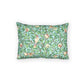 Decorative pillow with bird and floral pattern on a white background