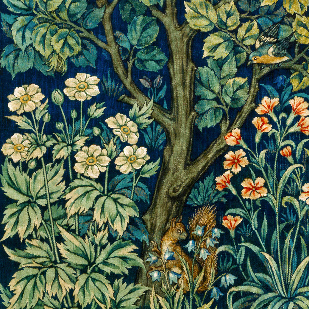 Decorative fabric with a tree, flowers, and a squirrel design on a dark blue background.