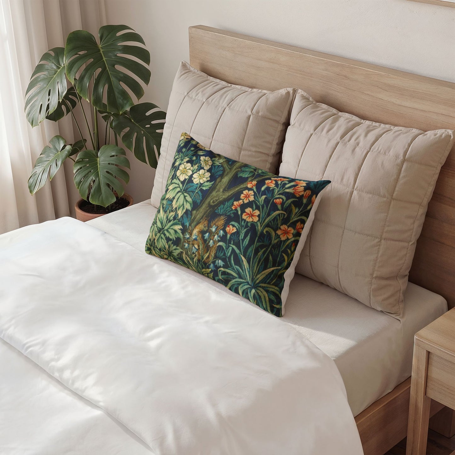 Decorative pillow with floral pattern on a bed in a bedroom setting