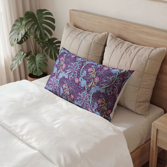 Decorative pillow with floral pattern on a bed in a bedroom setting