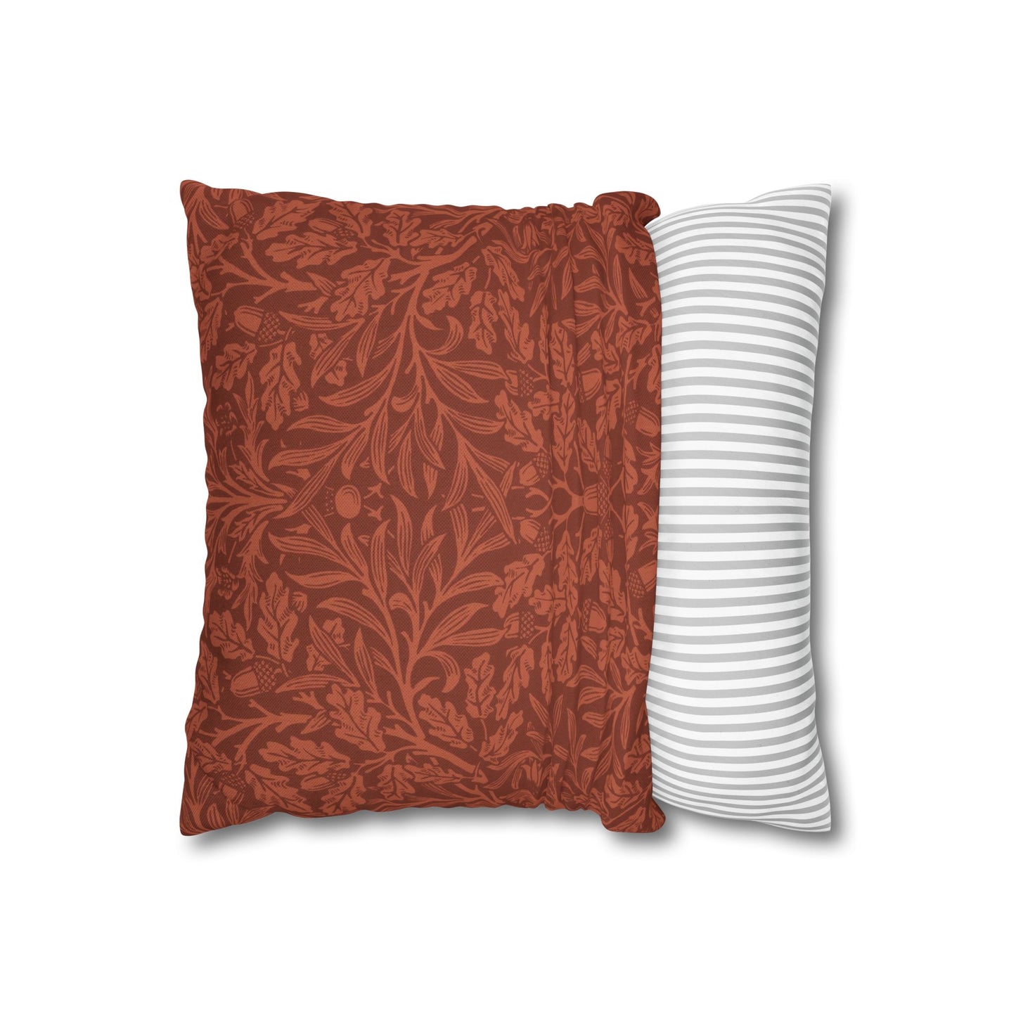 Two pillows, one with a floral pattern and the other with a striped pattern, on a white background.