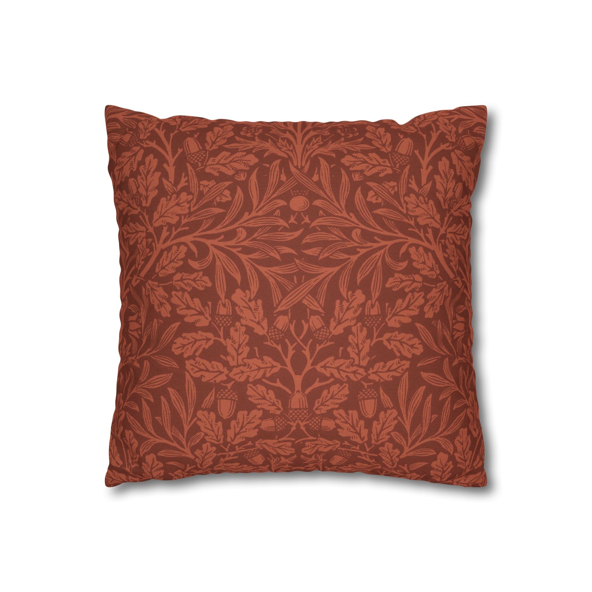 Decorative pillow with intricate leaf pattern on a white background