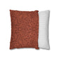 Two pillows, one with a red floral pattern and the other with white stripes, on a white background.