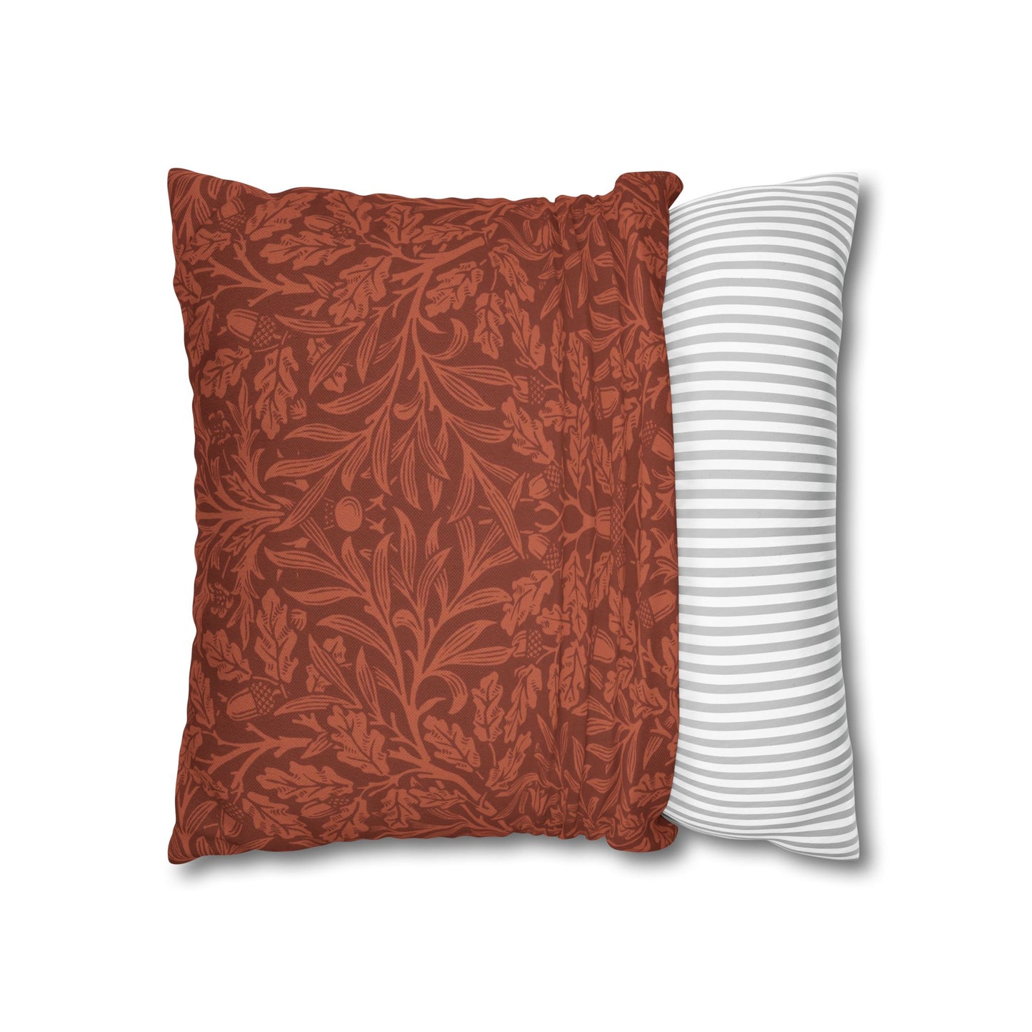 Two pillows, one with a floral pattern and the other with a striped pattern, on a white background.