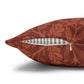 Decorative pillow with floral pattern and zipper on a white background