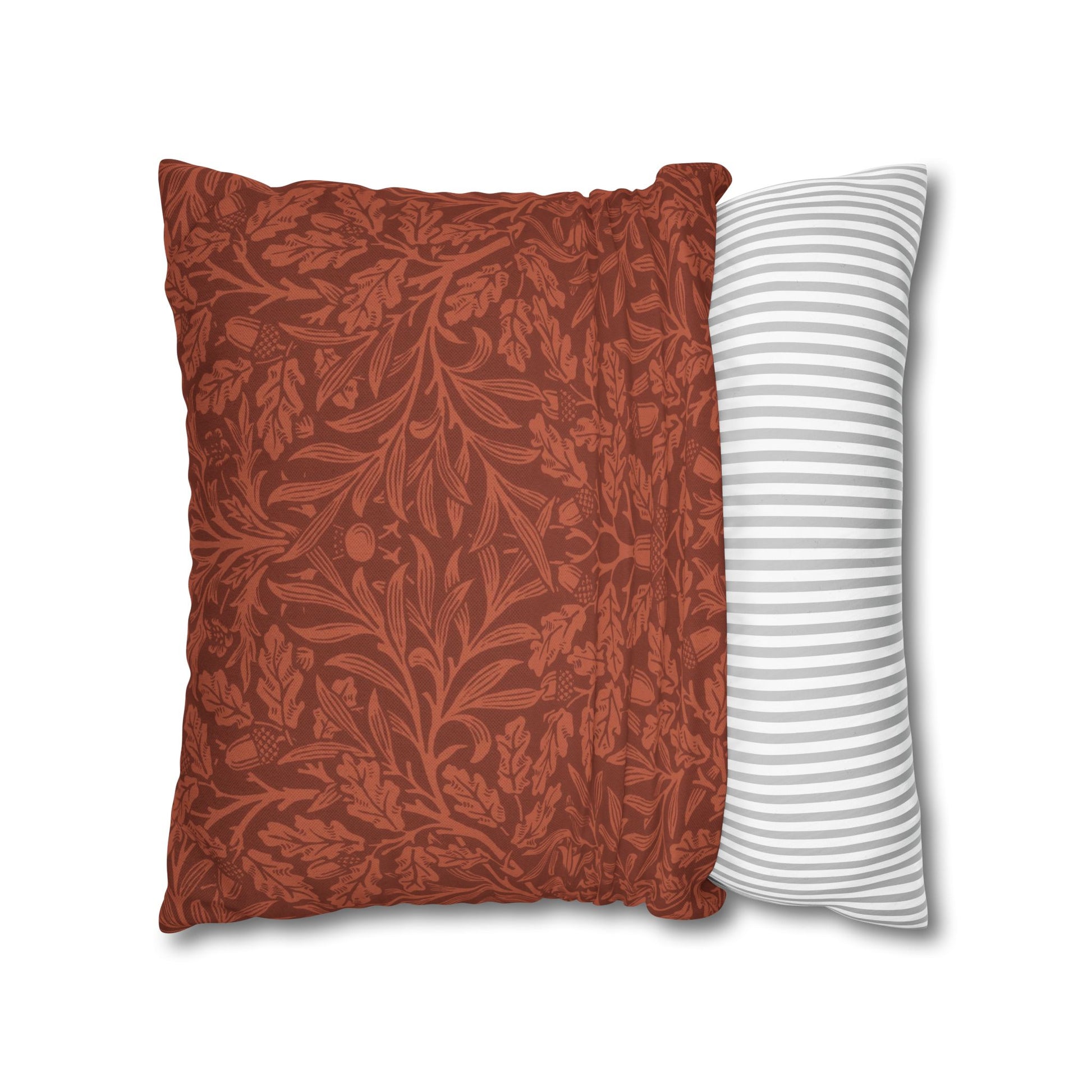 Two pillows, one with a floral pattern and the other with a striped design, on a white background.