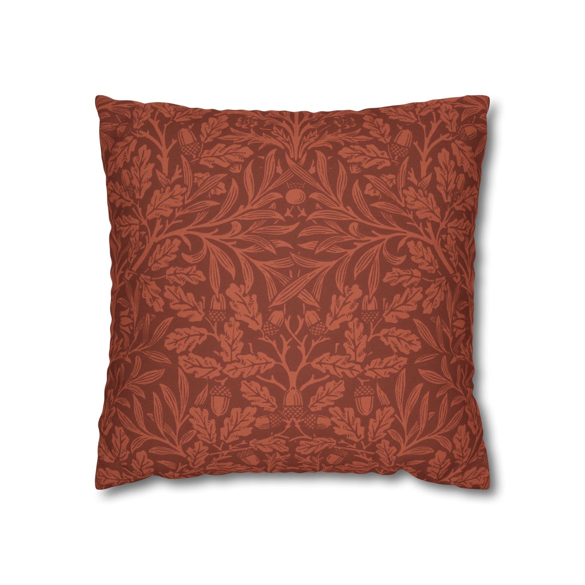 Decorative pillow with a red leaf pattern on a white background