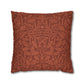 Decorative pillow with intricate leaf pattern on a white background