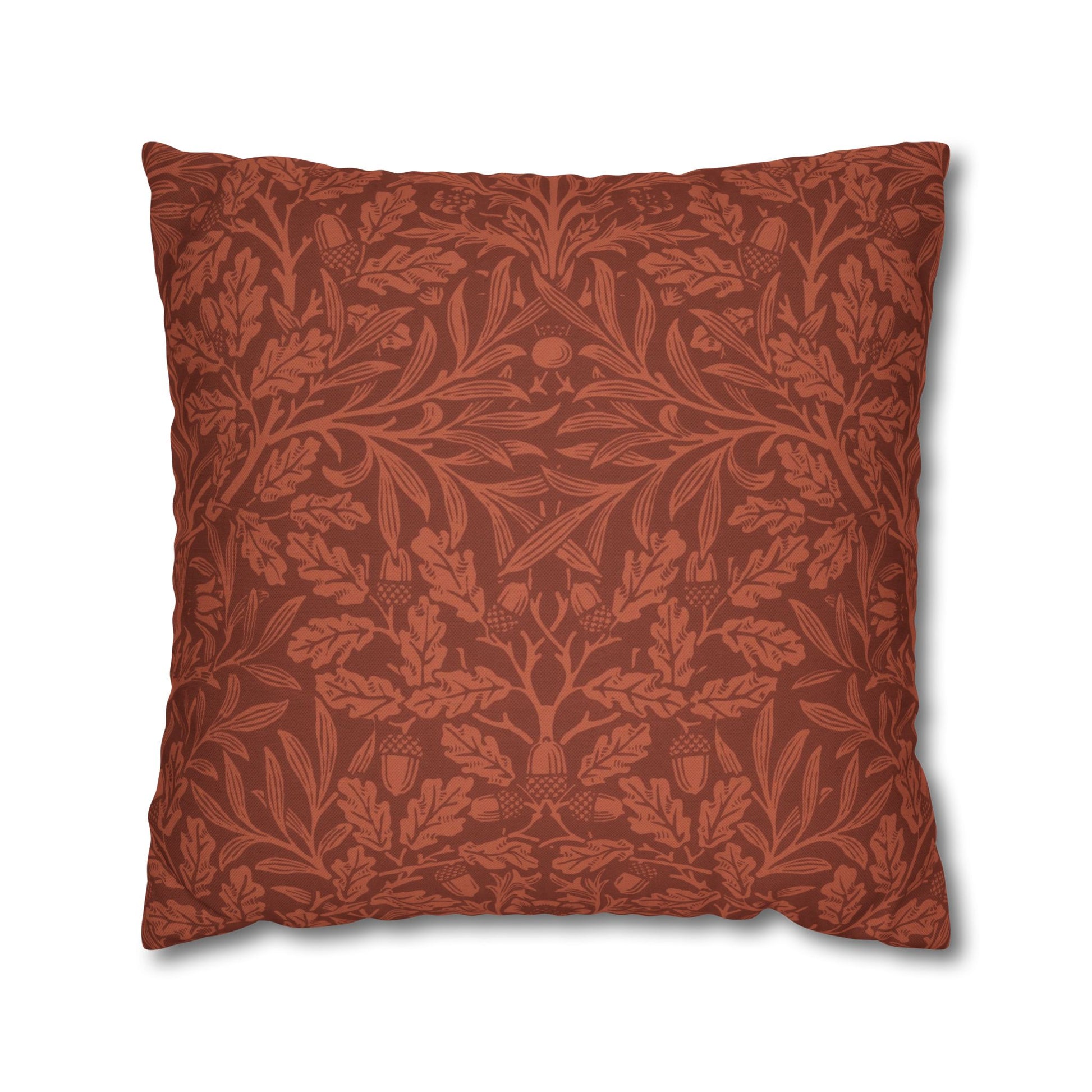 Decorative pillow with intricate leaf pattern on a white background