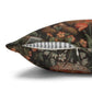 Decorative pillow with a floral and butterfly pattern on a white background