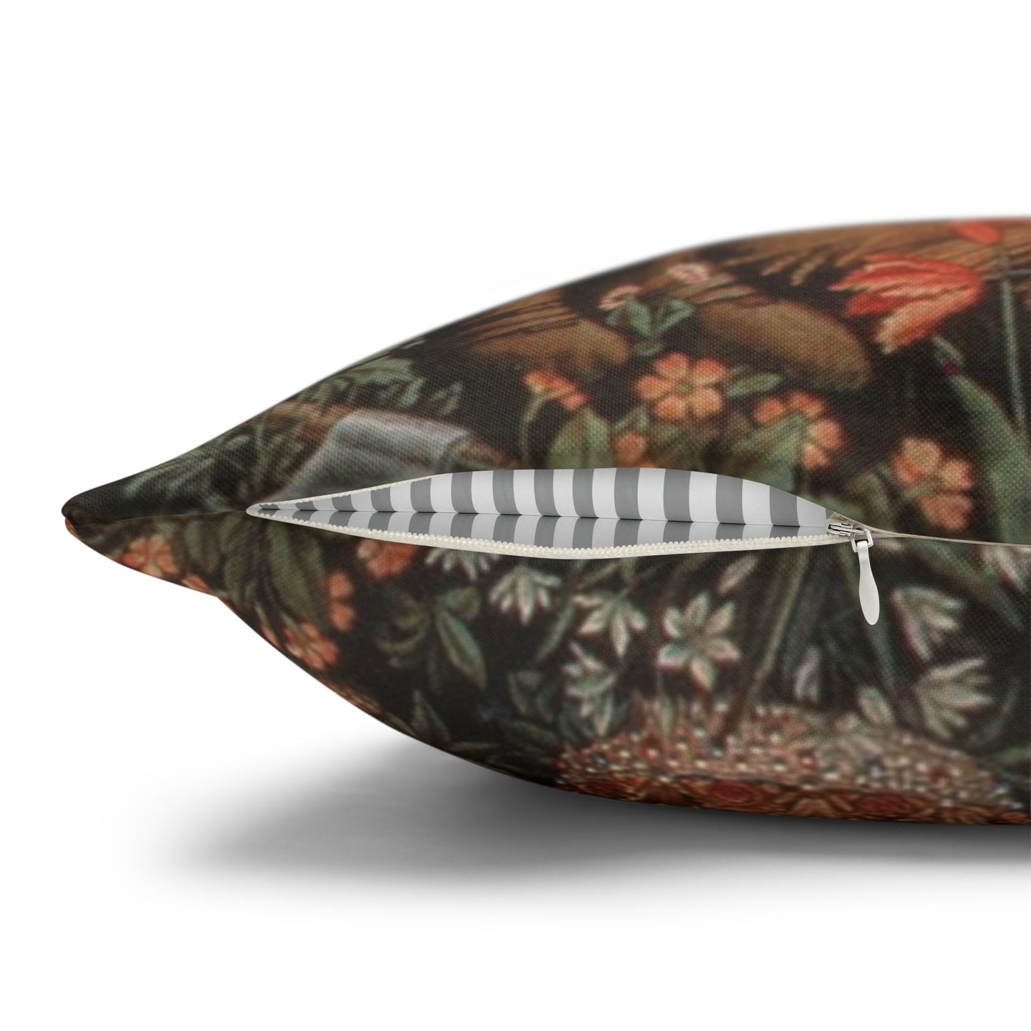 Decorative pillow with a floral and butterfly pattern on a white background