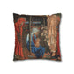 Decorative pillow with religious scene featuring a woman holding a child, surrounded by two figures.
