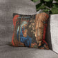 Decorative pillow with religious design on a gray couch