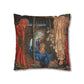 Decorative pillow with religious scene featuring a woman holding a child and another person in red robes.