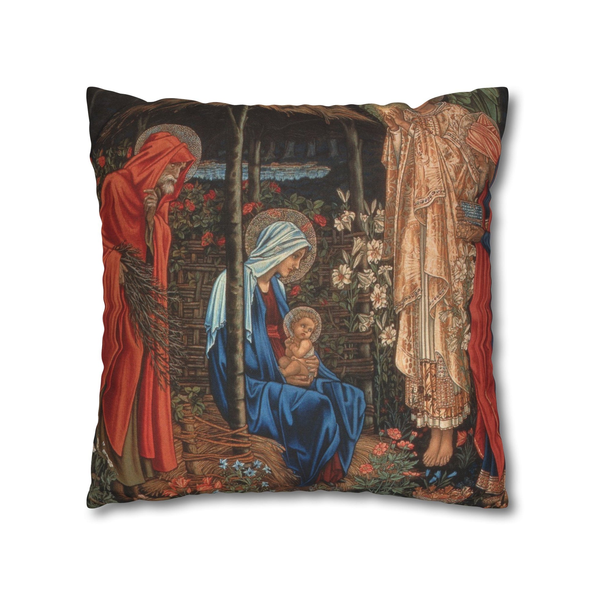 Decorative pillow with religious scene featuring a woman, child, and another figure.