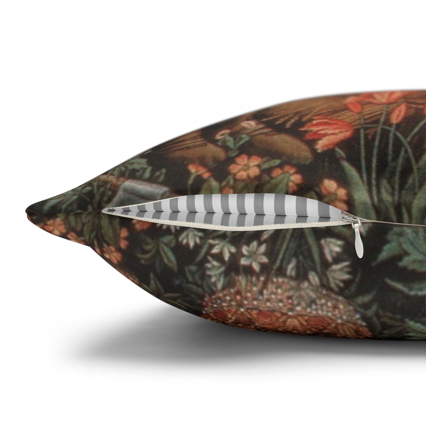 Decorative pillow with a floral and bird pattern on a white background