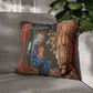 Decorative pillow with religious design on a gray couch