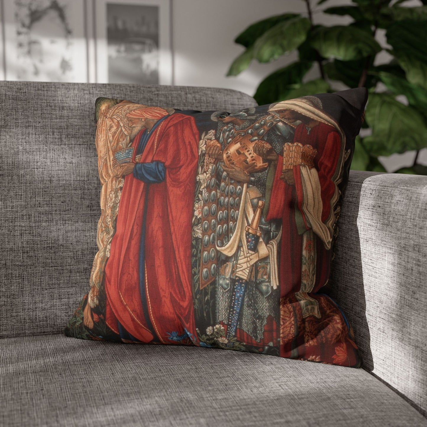 Decorative pillow with intricate design on a gray sofa