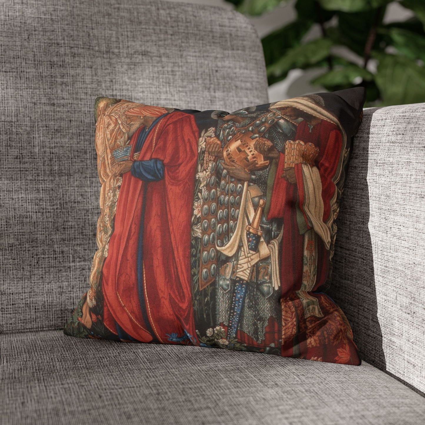 Decorative pillow with intricate design on a gray couch