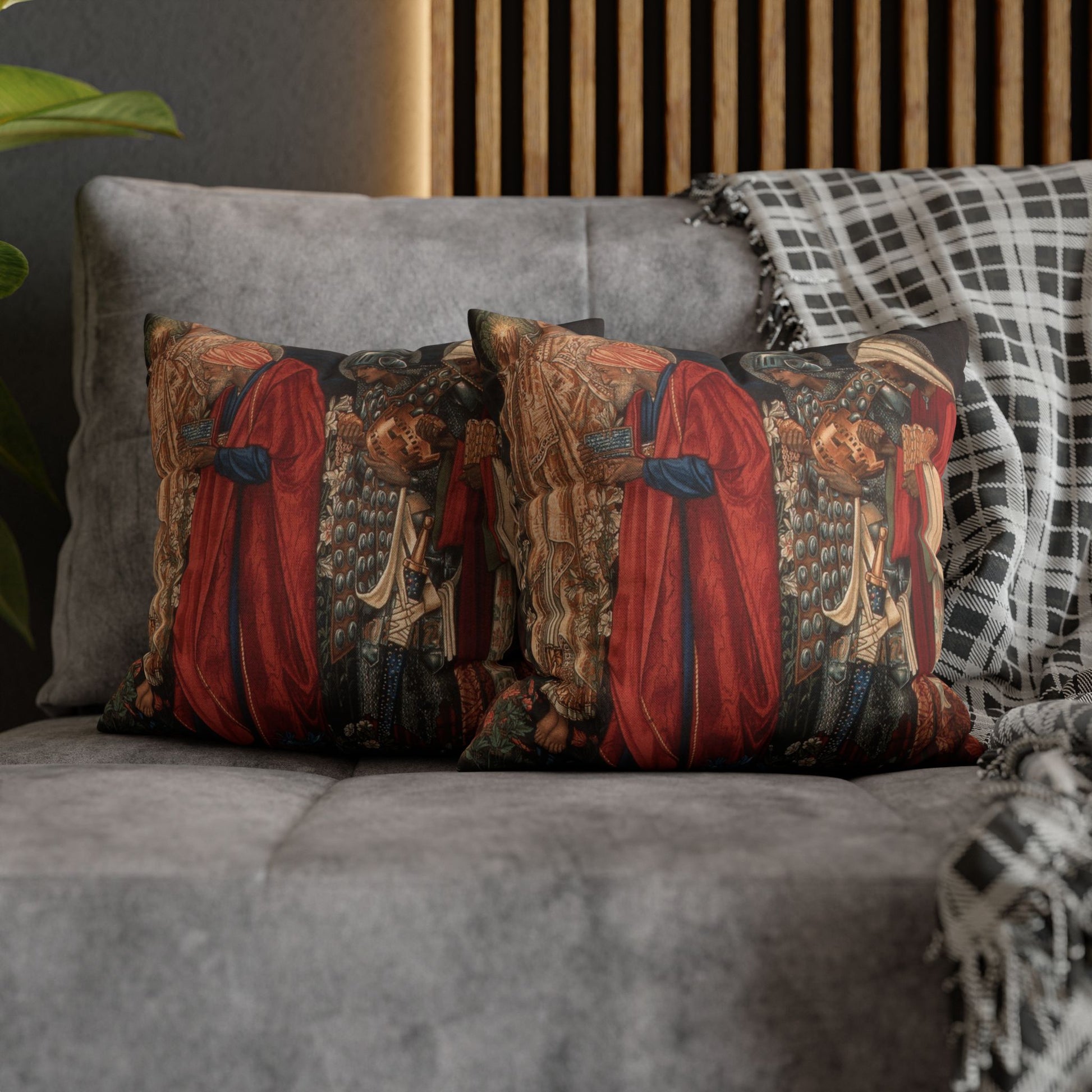 Decorative pillows with historical design on a gray sofa
