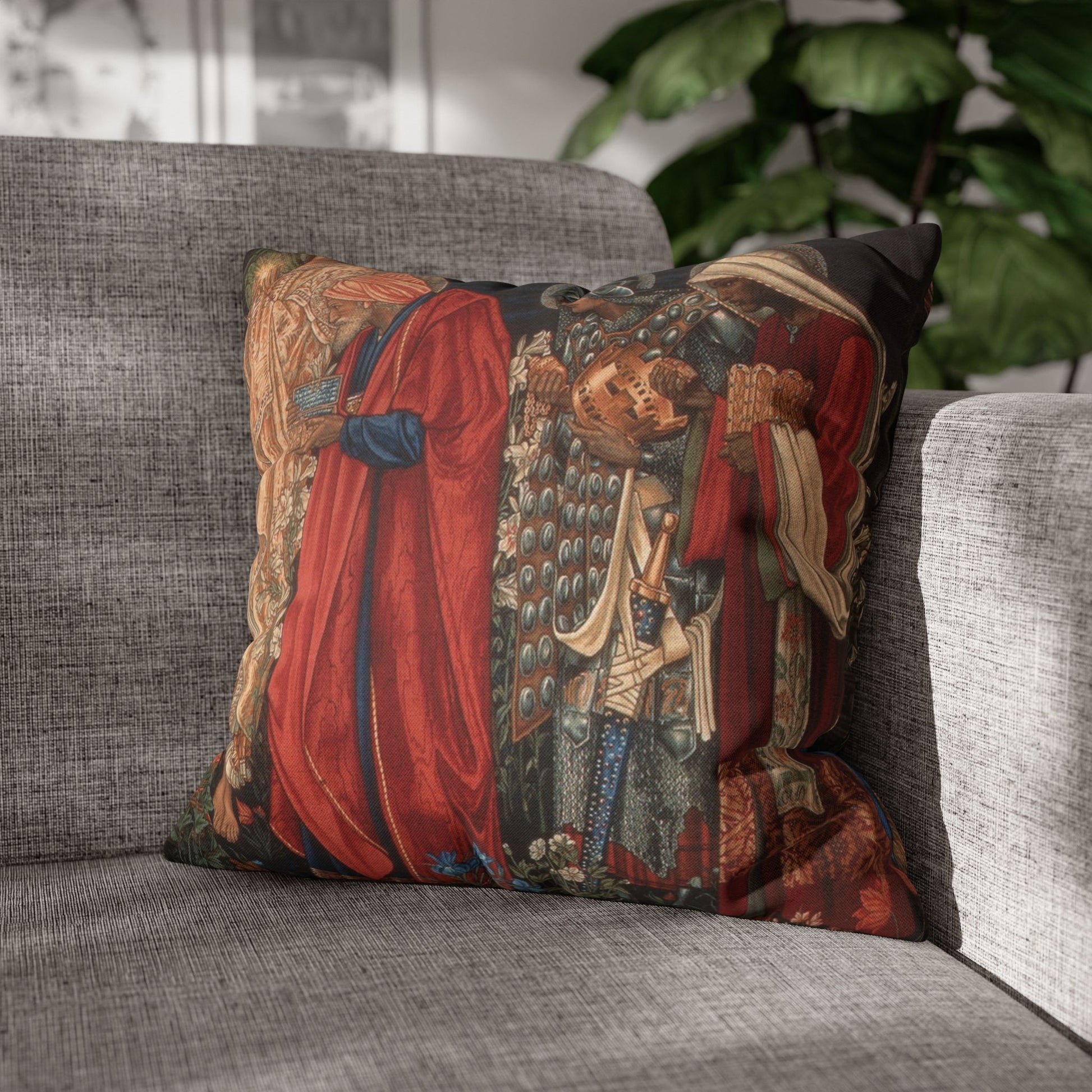 Decorative pillow with intricate design on a gray sofa