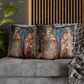 Decorative pillows with angel designs on a gray sofa.