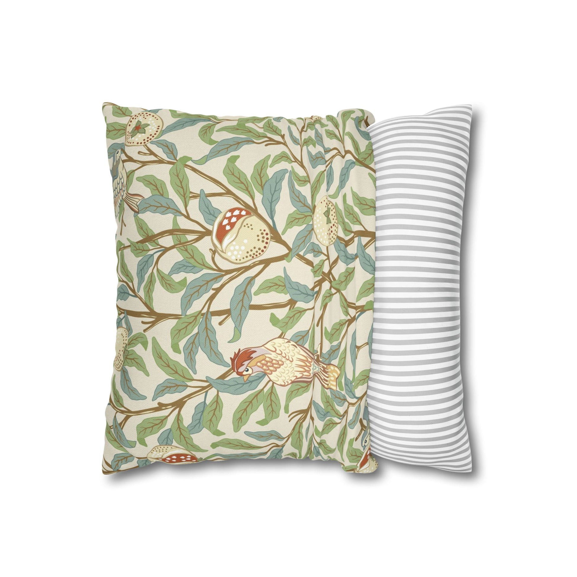 Decorative pillow with nature-themed design and a plain striped pillow on a white background