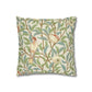 Decorative pillow with bird and leaf pattern on a white background