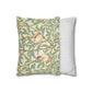 Decorative pillow with nature-themed design and a plain striped pillow on a white background