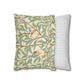 Decorative pillow with nature-themed design and a plain striped pillow on a white background
