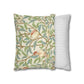 Decorative pillow with nature-themed design and a striped pillow next to it on a white background