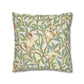 Decorative pillow with bird and leaf pattern on a white background