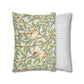 Decorative pillow with nature-themed design and a striped pillow on a white background