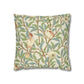 Decorative pillow with bird and leaf pattern on a white background