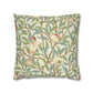 Decorative pillow with bird and leaf pattern on a white background