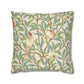 Decorative pillow with bird and floral pattern on a white background