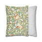 Decorative pillow with nature-themed design and a striped pillow next to it on a white background