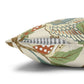 Decorative pillow with nature-themed pattern on a white background