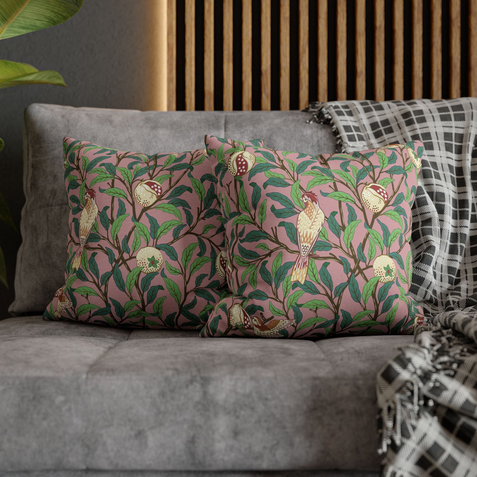 Decorative pillows with floral pattern on a gray sofa