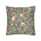Decorative pillow with bird and leaf pattern on a pink background